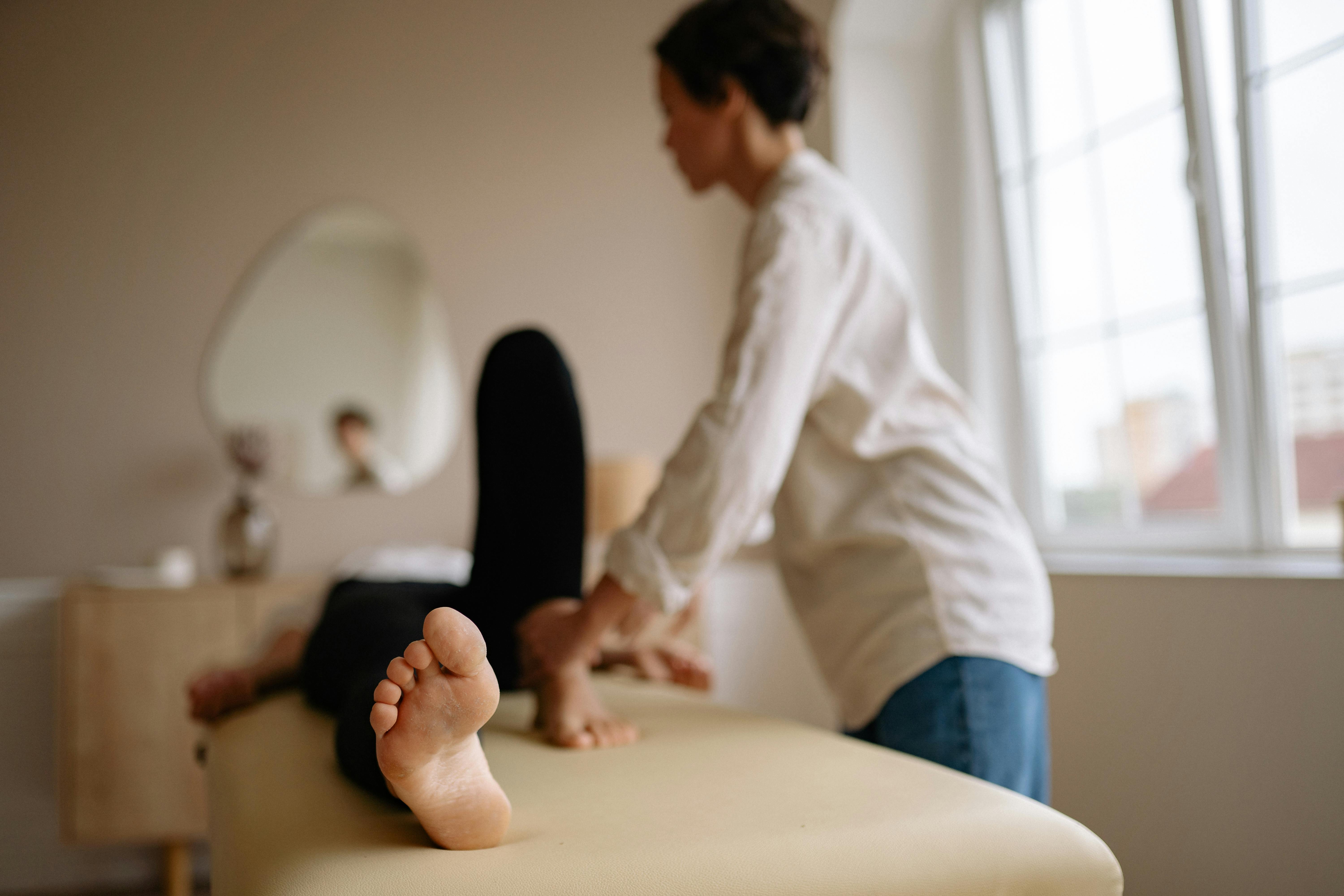 A practitioner performing a gentle mobilisation treatment